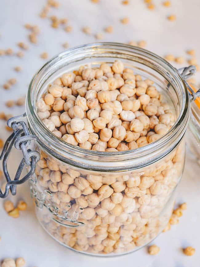 Dried chickpeas in a jar seen from eye level
