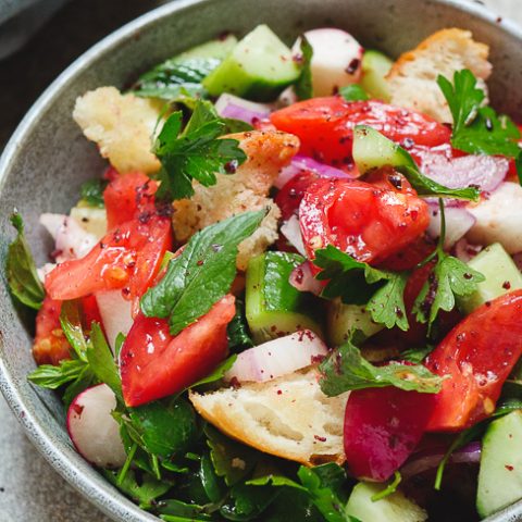 Fattoush - Levantine bread and vegetable salad with sumac, shown from side