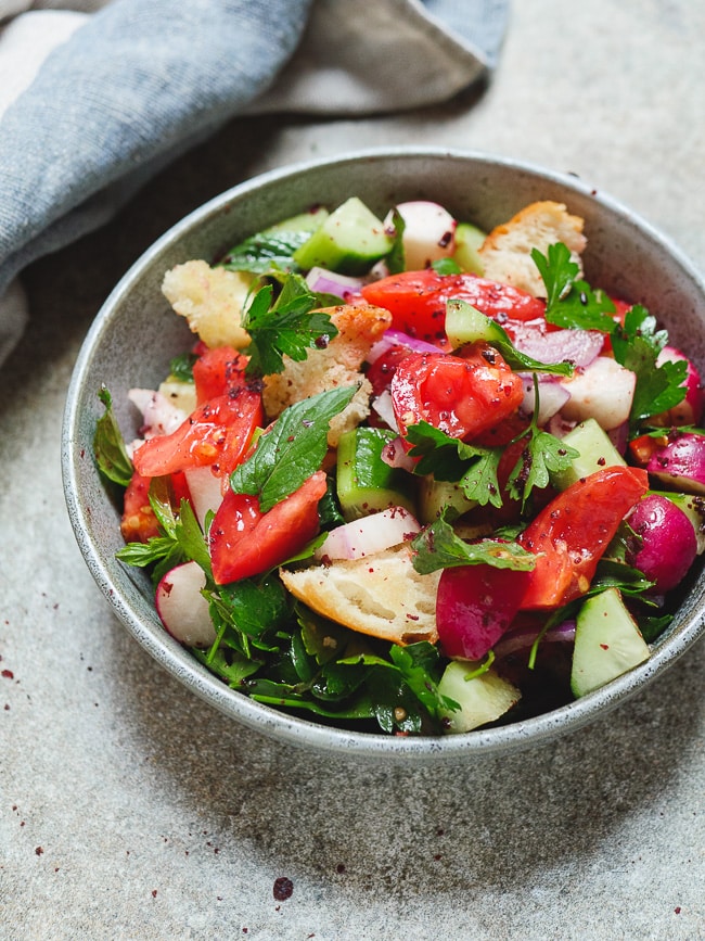 Fattoush - Levantine bread and vegetable salad with sumac, shown from side