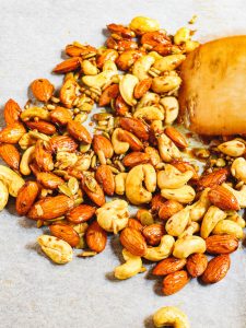 Middle Eastern spiced nuts on baking parchment before baking