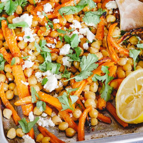 Roast carrots, warm chickpeas and caraway up-close seen from side