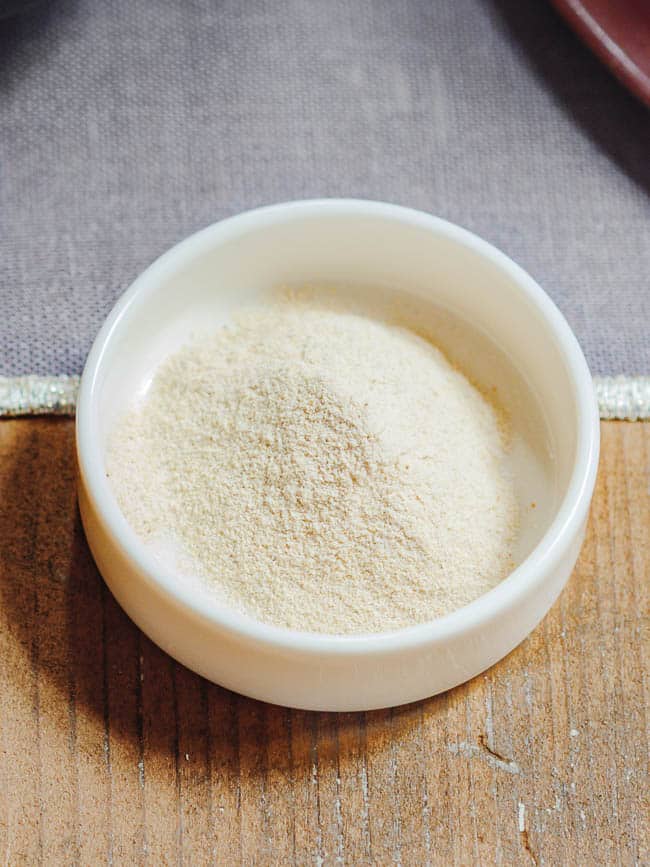 Salep powder in small, white bowl seen from eye level