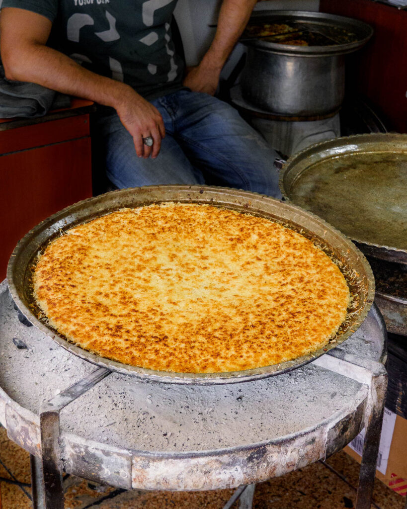 Cooked künefe in a large tray.