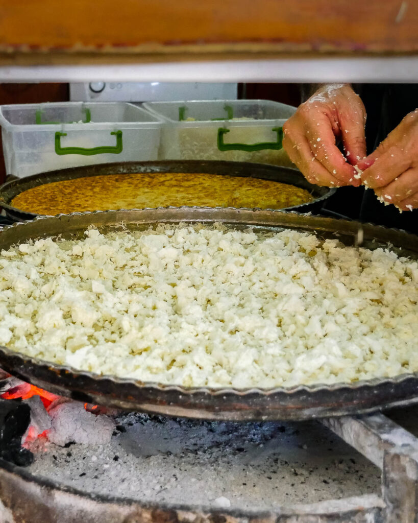Close-up of a künefe in the making, with lots of cheese