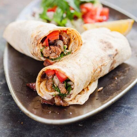 Tantuni wrap, halved and seen up close from the side