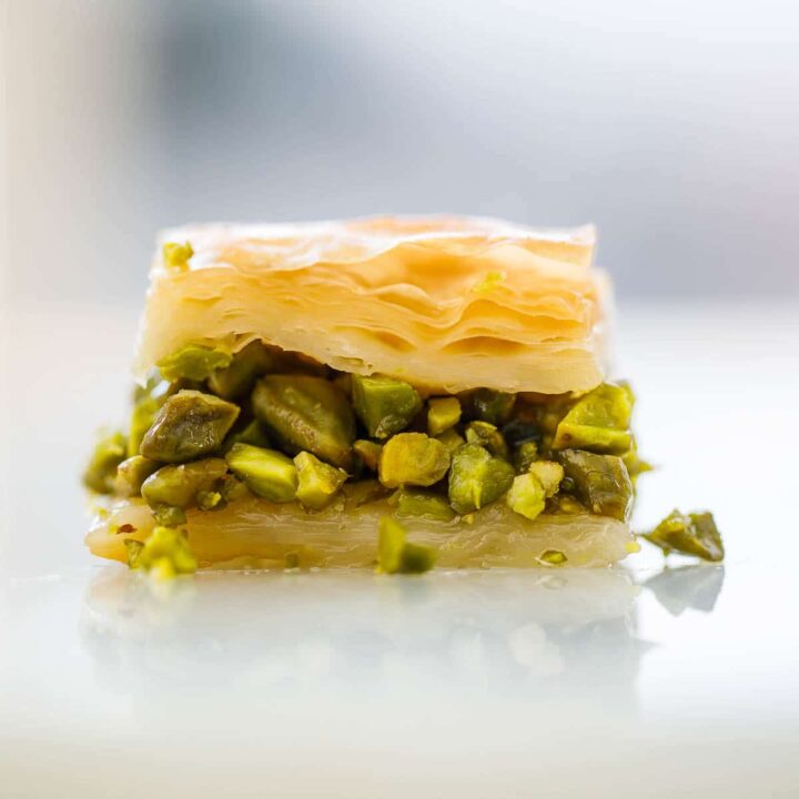 Single piece of baklava seen up close from the side.
