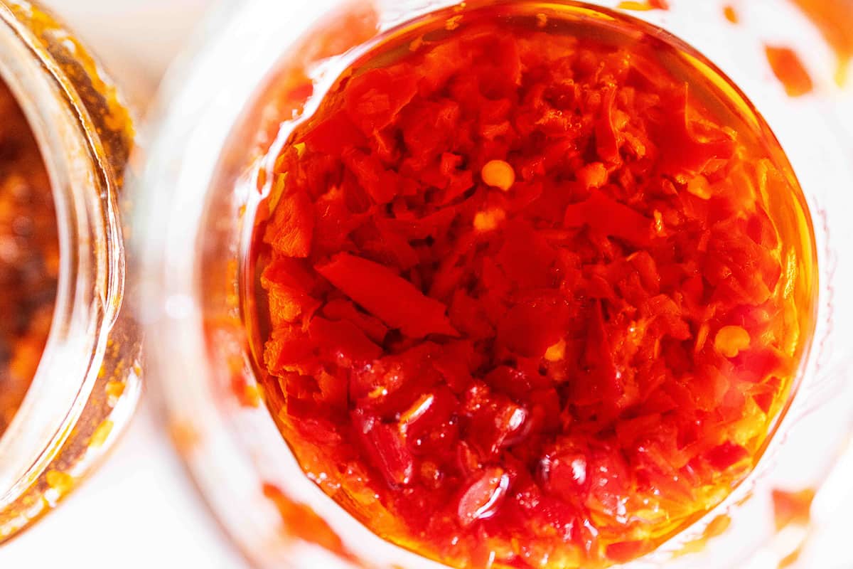 close-up of red shatta in a jar